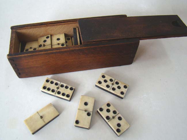 A boxed set of Civil War era bone and ebony dominoes circa 1860-1870